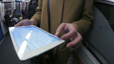 Entertainment-with-pad-during-routine-subway-travel