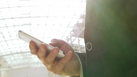 Businessman-chatting-on-smartphone