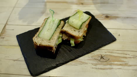 Serving-a-portion-of-sandwiches-in-cafe