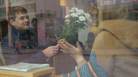 Man-Giving-Flowers-on-Date