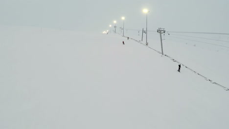 Chair-Lifts-And-Skiers-On-Slope