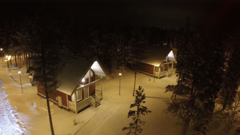 Flying-over-guest-houses-in-winter-holiday-village