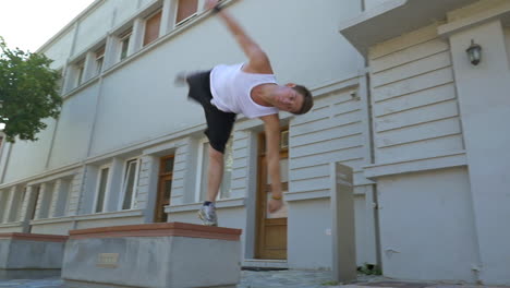 Young-athlete-performing-parkour-trick