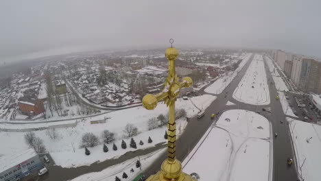 Golden-cross-on-the-church-in-city-aerial-view