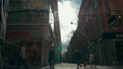 Unidentified-People-Walk-Along-A-Busy-Street