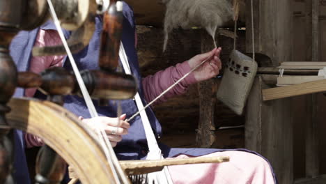 Young-female-spinning-yarn