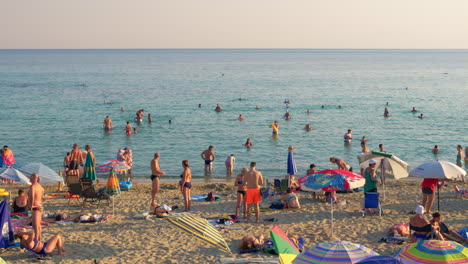 People-having-enjoyable-time-at-the-seaside-Greece