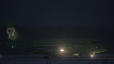 S7-Airlines-plane-on-runway-after-landing-at-night