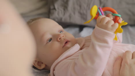 Mum-and-baby-playing-with-toy