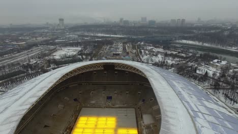 Flying-over-Luzhniki-Stadium-with-Moscow-winter-view-in-background-Russia