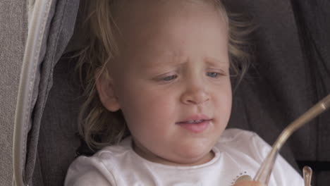 A-closeup-of-a-baby-girls-face-who-is-wearing-female-sunglasses-upside-down