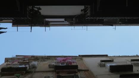 Sky-and-houses-with-linen-outside-bottom-view-Naples-Italy
