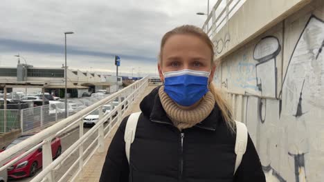 Outdoor-urban-portrait-of-a-woman-in-mask-COVID-19