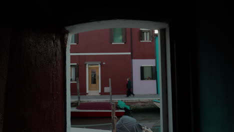 Burano-houses-and-canal-viewed-through-the-doorway-Italy