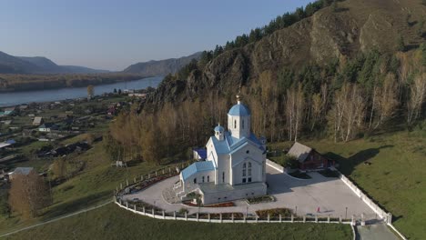 Aerial-View-of-Temple-in-Majestic-Mountains