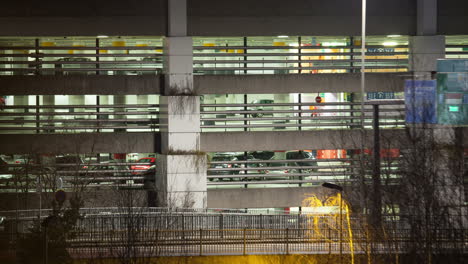 Timelapse-of-traffic-near-parking-deck-at-night