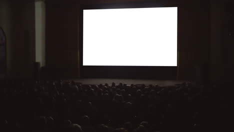 People-enjoying-the-film-in-cinema