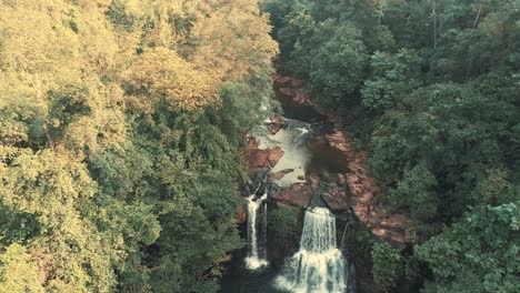 Drone-captures-waterfall-in-rainforest