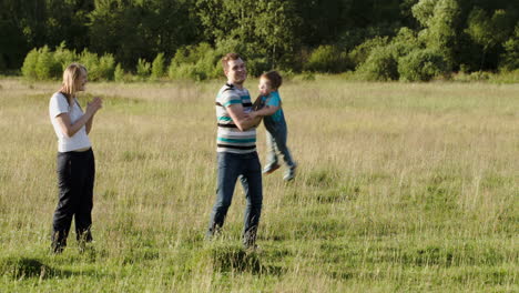 Family-of-three-spending-time-together-outdoor