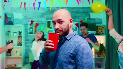 Zoom-in-shot-of-young-man-drinking-alcohol