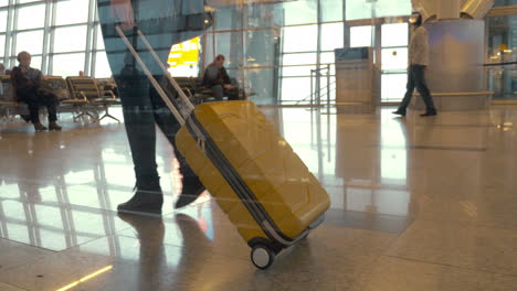 Walking-with-travel-bag-at-the-airport