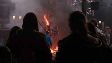 People-gathering-to-look-at-ninot-burning-during-Fallas-festival-Spain