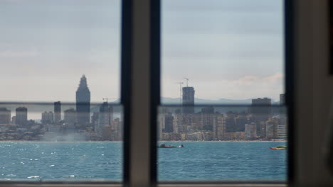 View-of-the-coastal-town-through-the-boat-window