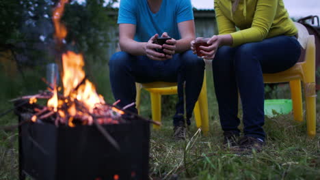 Couple-having-tea-by-fire-in-the-evening