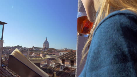 Woman-on-the-balcony-having-tea-and-making-sketches