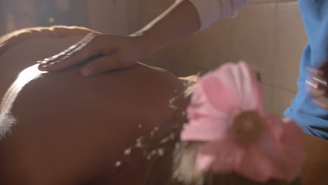 Woman-under-hot-stone-back-massage