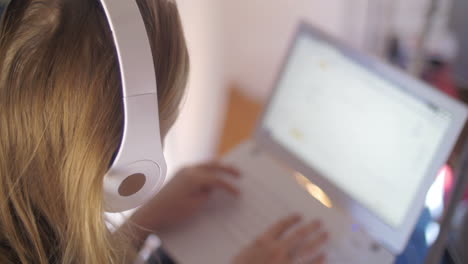 Woman-in-headphones-using-laptop