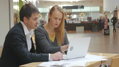 Man-and-Woman-Discussing-New-Business