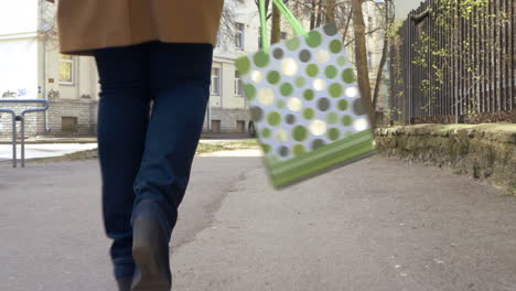 Woman-Walking-with-Green-Shopping-Bag