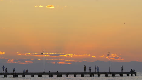 Cinemagraph---People-enjoying-seascape-from-the-pier-at-sunset