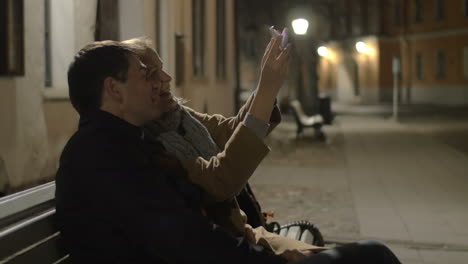 Happy-couple-making-selfie-in-evening-street