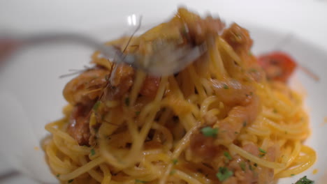 Close-up-shot-of-eating-pasta-dish-in-restaurant