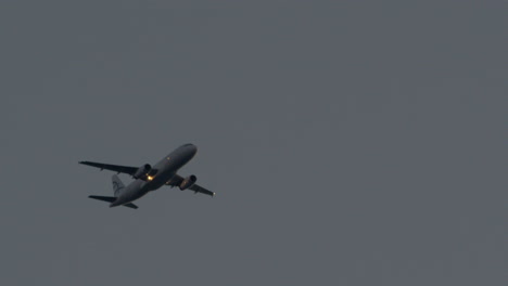 View-of-flying-aircraft-in-the-grey-rainy-sky-Thessaloniki-International-Airport-Greece