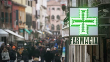 Pharmacy-sign-hanging-in-crowded-street