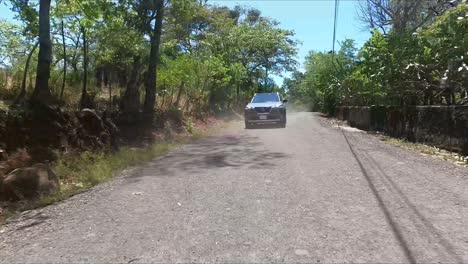 compact-crossover,-SUV-nissan-x-trail-driving-on-street-between-trees