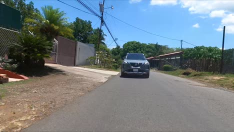 nissan-x-trail-driving-on-street-between-trees,compact-crossover-SUV