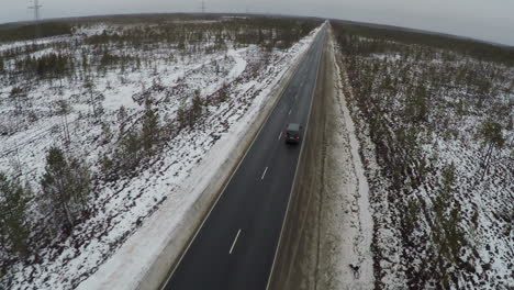 Car-On-The-Road-In-Winter-From-Air