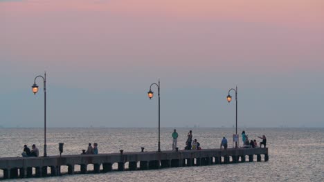People-enjoying-seascape-from-the-pier