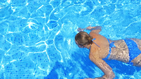 Woman-Swimming-in-Open-Air-Swimming-Pool