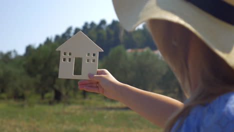 Woman-Holding-House-Silhouette