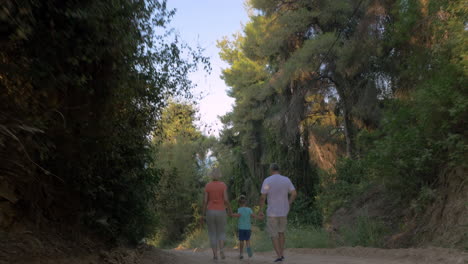 Child-and-grandparents-running-in-the-forest