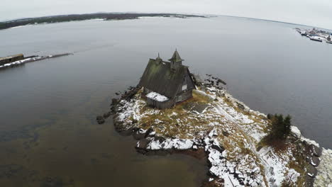 Flying-over-the-township-on-coast-in-winter