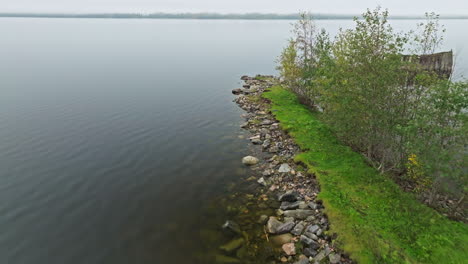 Seawall-At-The-Calm-Lake-On-A-Cloudy-Day-In-Sweden