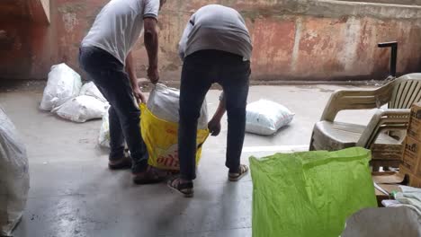 Workers-are-preparing-the-goods-of-plastic-sacks-for-the-parcel---Transportation