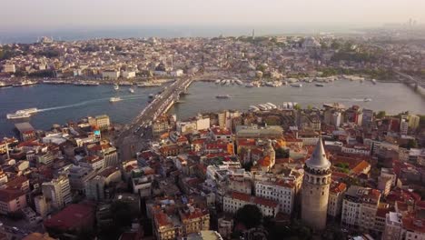 Aerial-flying-towards-Golden-Horn-passing-Galata-Tower,-Istanbul