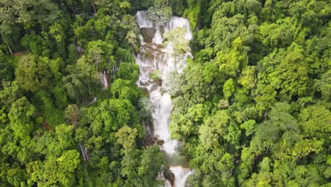 Aerial-Overhead-View-Of-Kuang-Si-Falls-Cascading-Down-Surrounding-By-Tropical-Forest-Trees-In-Luang-Prabang